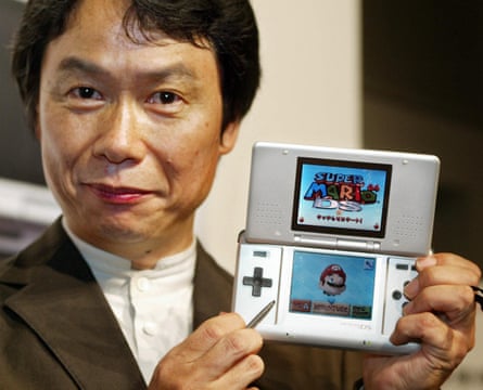 Nintendo's Shigeru Miyamoto with the DS system in 2004.