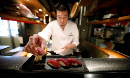 A sushi chef prepares a plate of beef sushi at the Nikuzushi (beef sushi) restaurant in Tokyo.