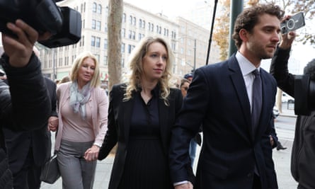 Elizabeth Holmes arrives at federal court with her partner, Billy Evans, and her mother, Noel Holmes, in San Jose, California.