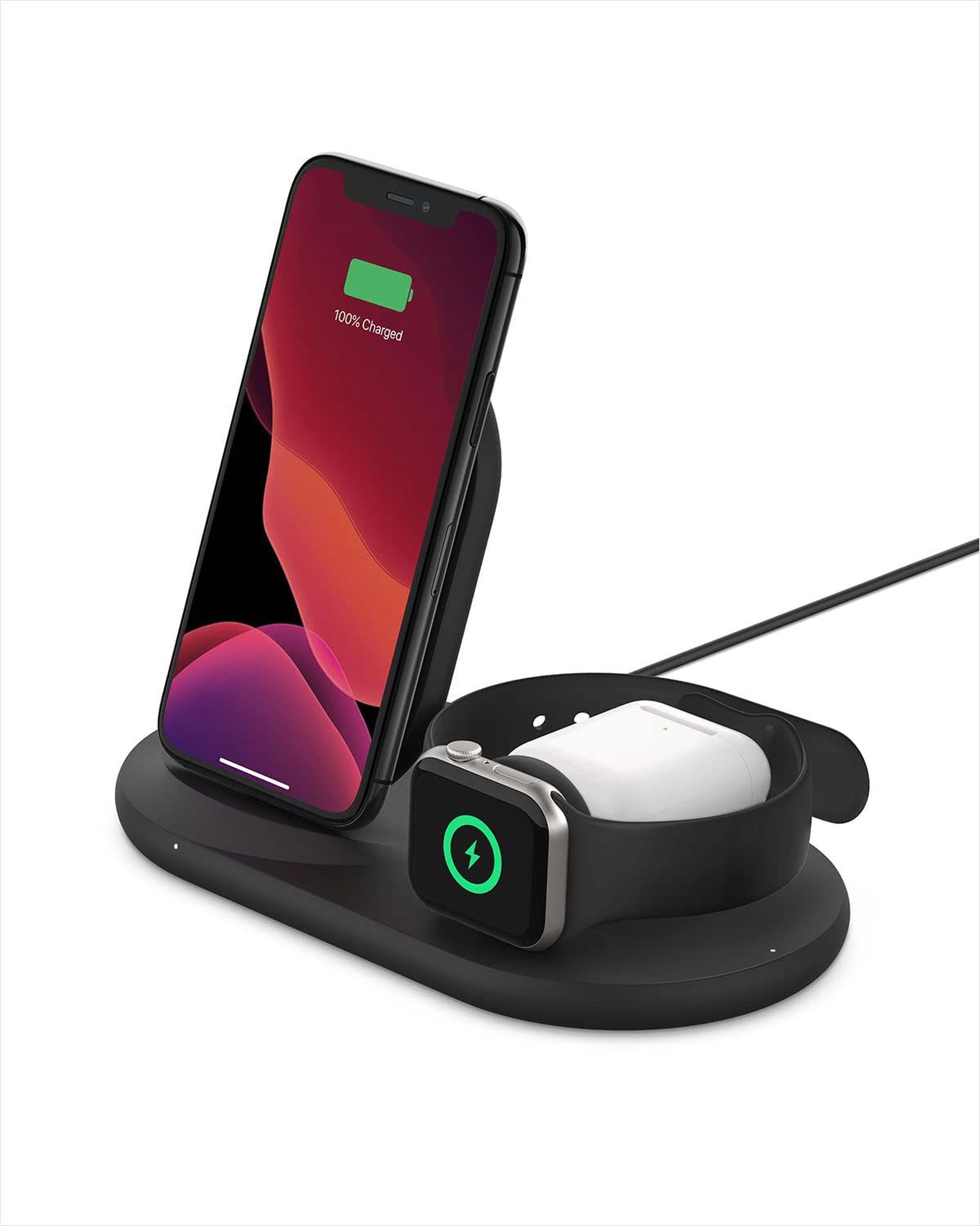 Black charger with a phone, a case for headphones and a watch