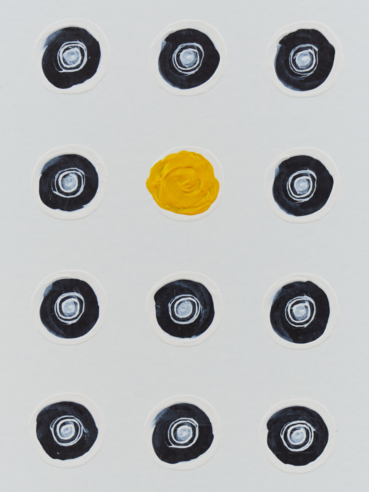 repeated black circles with a yellow circle