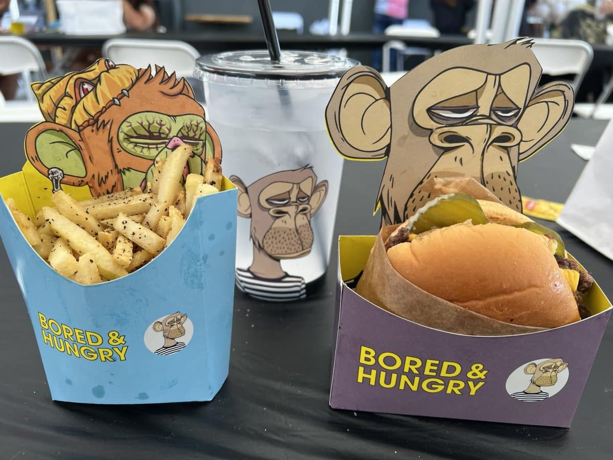 image of a burger with fries and a drink from Bored and Hungry restaurant