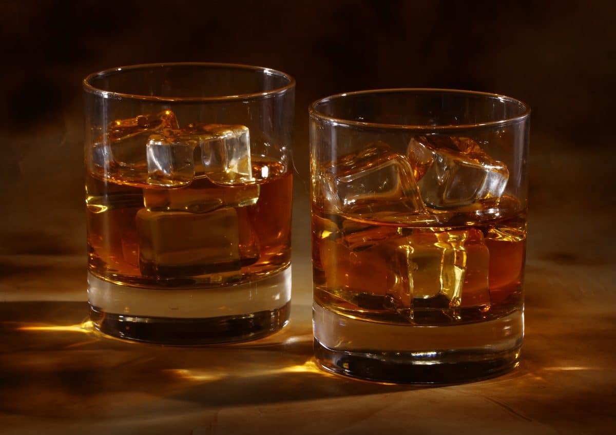 image of two glasses of whiskey with ice