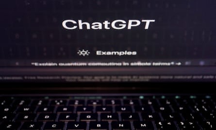 A keyboard reflected on a computer screen displaying the ChatGPT website