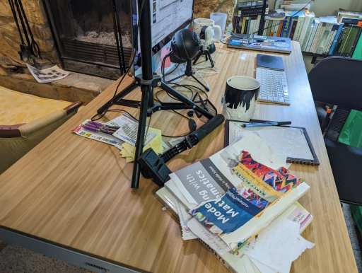 Flexispot Q8 desk with a lot of clutter... but also a lot of empty space. 