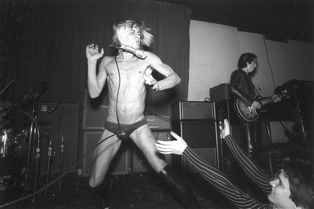 Iggy Pop performs onstage with the Stooges at the Whiskey A Go Go, Los Angeles, California, October 1973. At right is guitarist James Williamson.