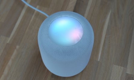 Blank Apple HomePod showing colored lights in response to a query.