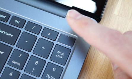 One finger on the fingerprint scanner on the power button at the top right of the keyboard.