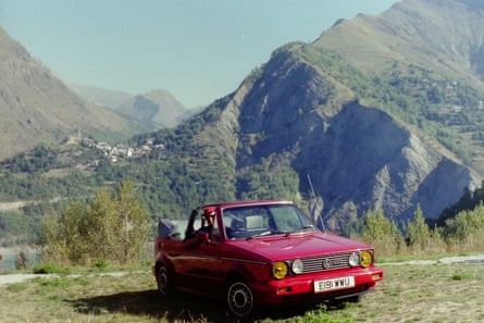 Paul Elcock in his red Mk1 Golf GTI convertible in the French Alps, 1989.