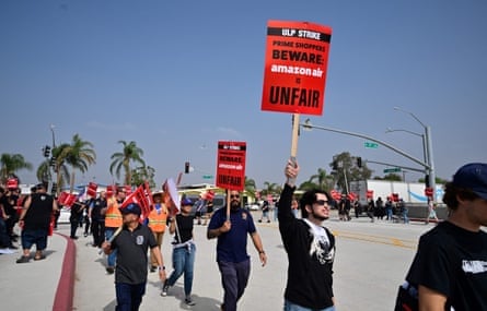 Workers at Amazon's west coast air cargo fulfillment center in San Bernardino, California, protest outside the facility on October 14, 2022 over claims of an unsafe work environment and low wages.