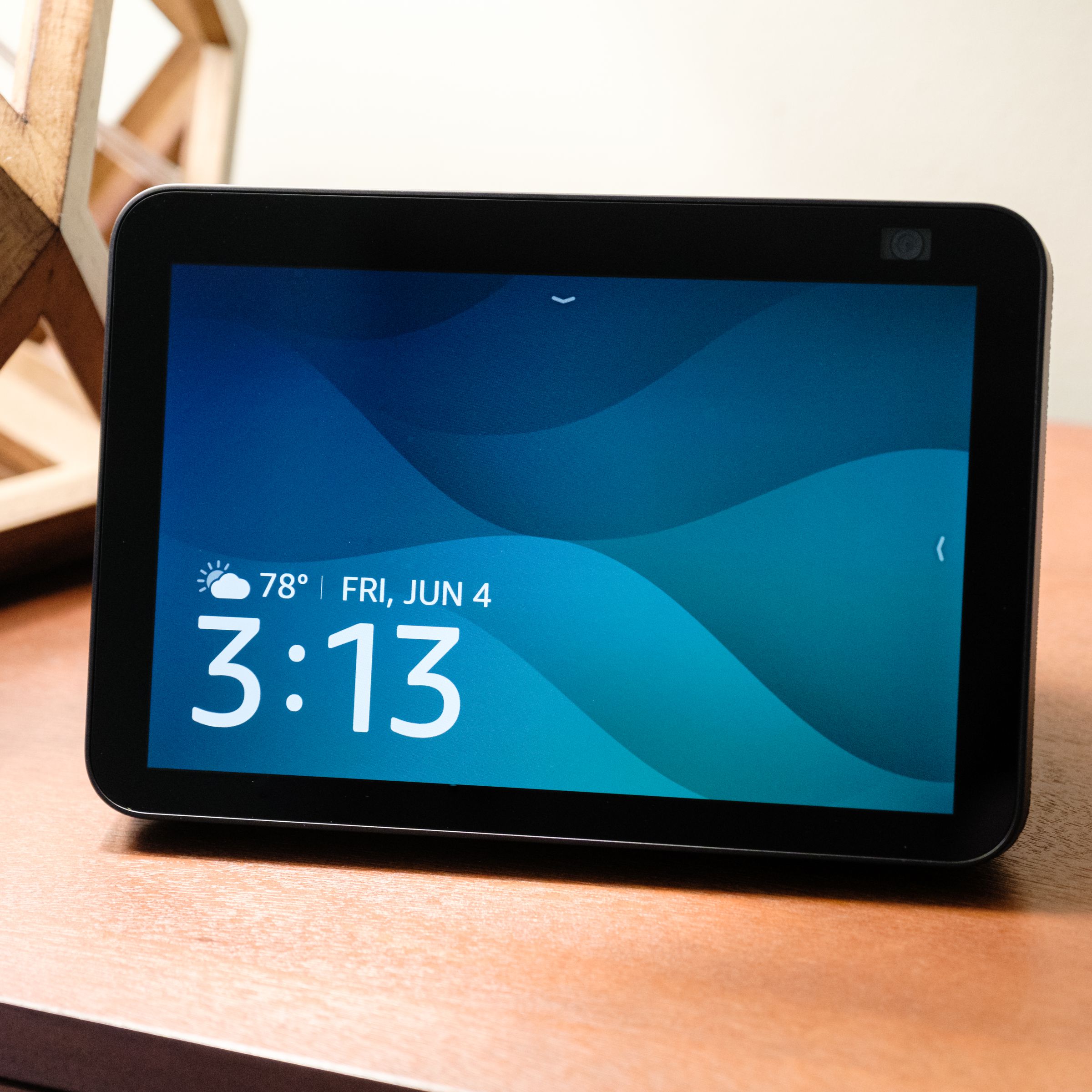 The second generation Echo Show 8 with its main screen exposed and resting on a table.
