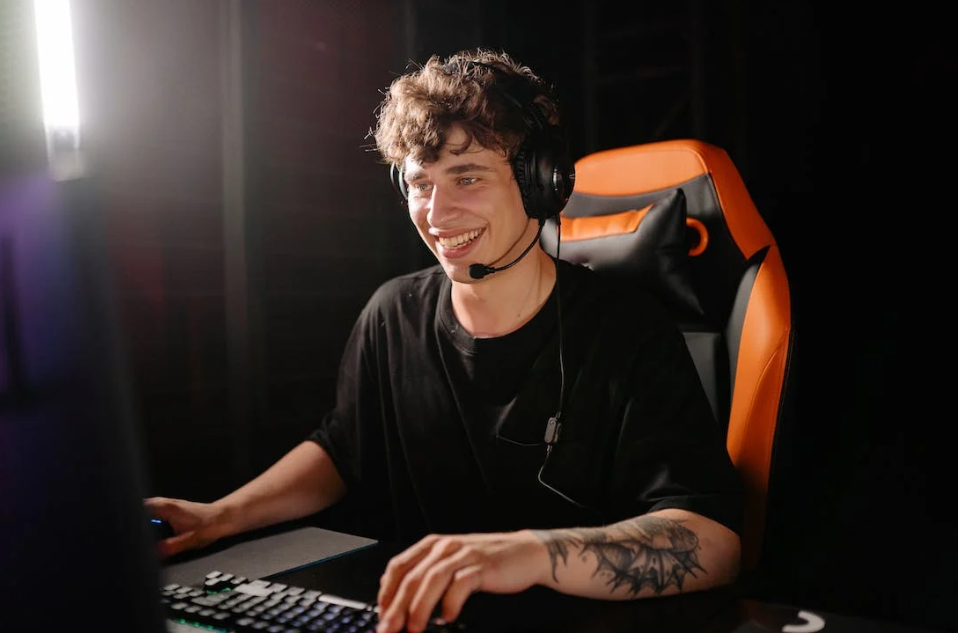 man sitting in a gaming chair playing Web3 games