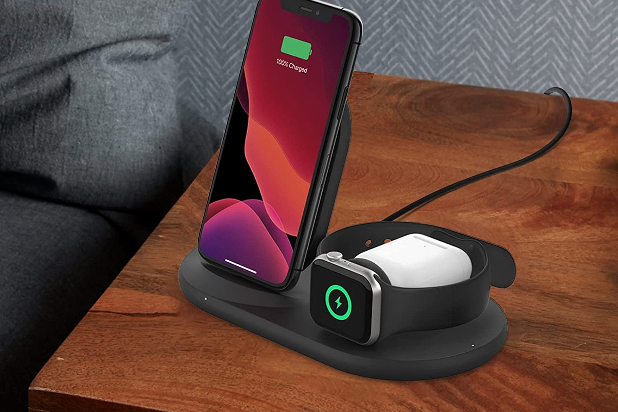 Apple phone and watch on charging stand