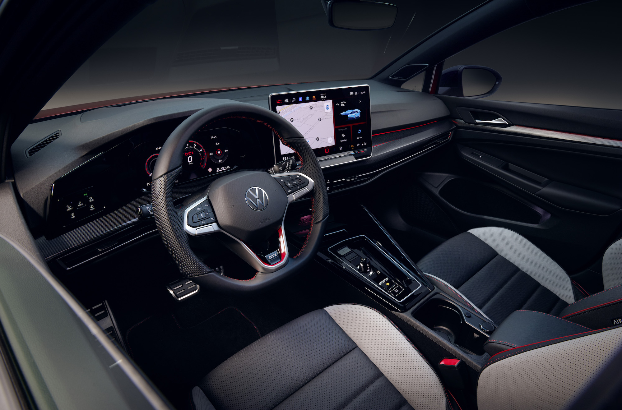 An image showing the interior of a new Volkswagen Gold, including the steering wheel and touchscreen.