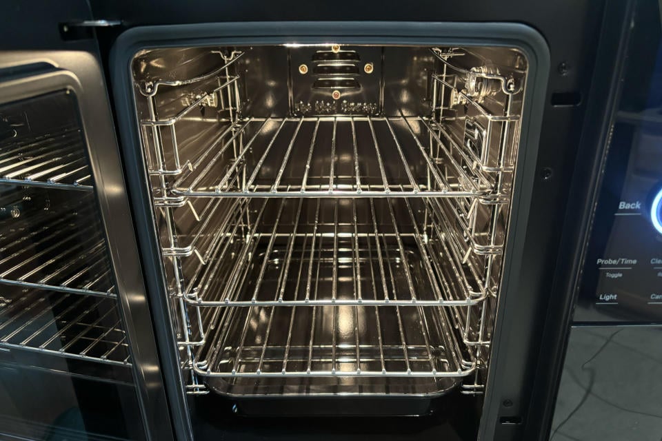 GE Profile Smart Indoor Smoker's interior, including removable racks, rack holders and the drip pan.