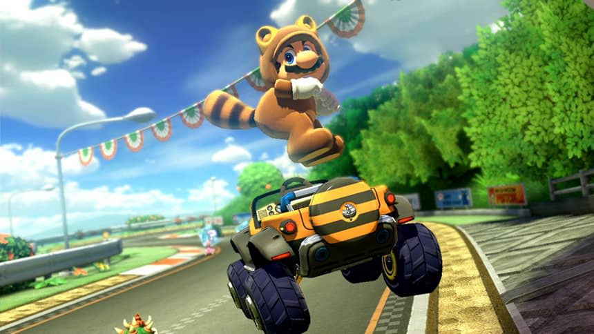 Mario in his Tanooki (raccoon-like) suit, jumping in the air and sticking his butt out over his striped SUV.