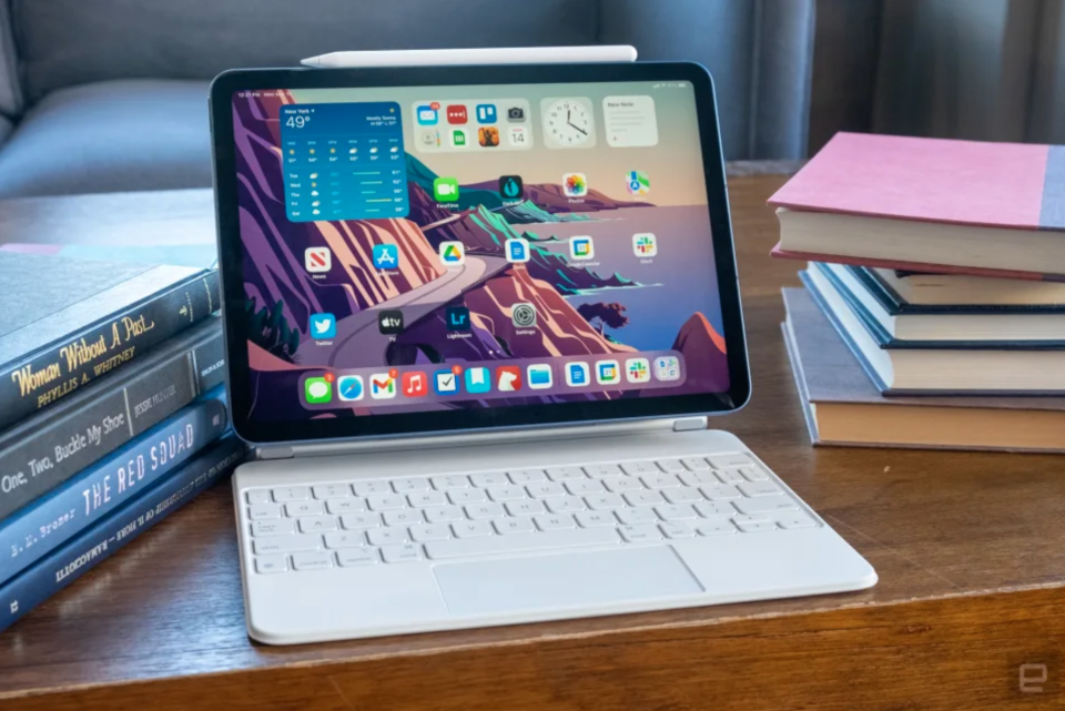 An iPad Air with a keyboard on a table.