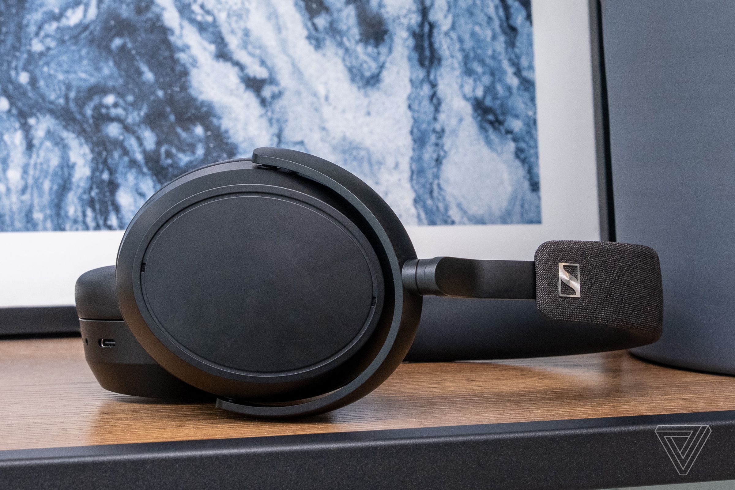 A photo of Sennheiser’s Momentum 4 Wireless headphones on a table.