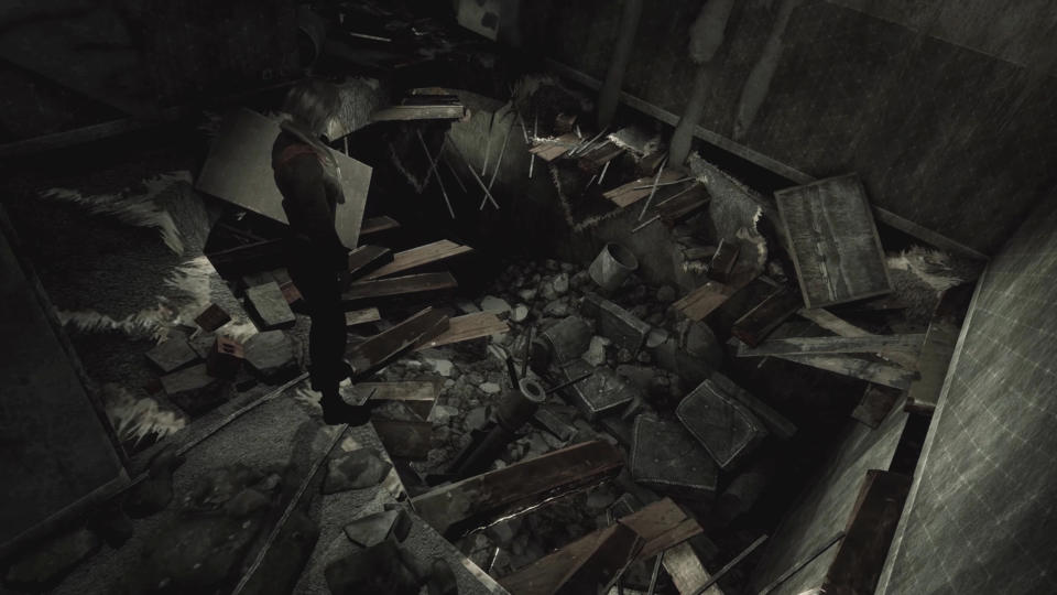 An image from Hollowbody showing the main character, Mica, standing over a large hole in the floor of an apartment, with debris everywhere.