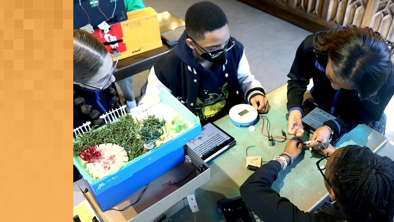 A small group of students uses the Labdisc All-in-One Science Lab to measure the electrical current in a battery.