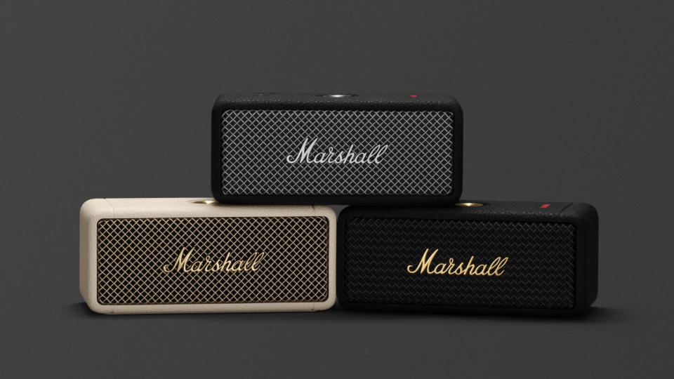 Three Marshall Emberton II Bluetooth speakers stacked on top of each other forming a pyramid. Dark gray background.