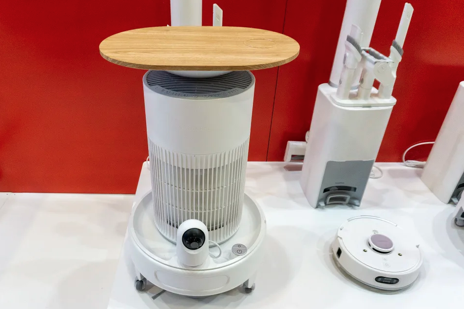 A robot vacuum cleaner with a table.