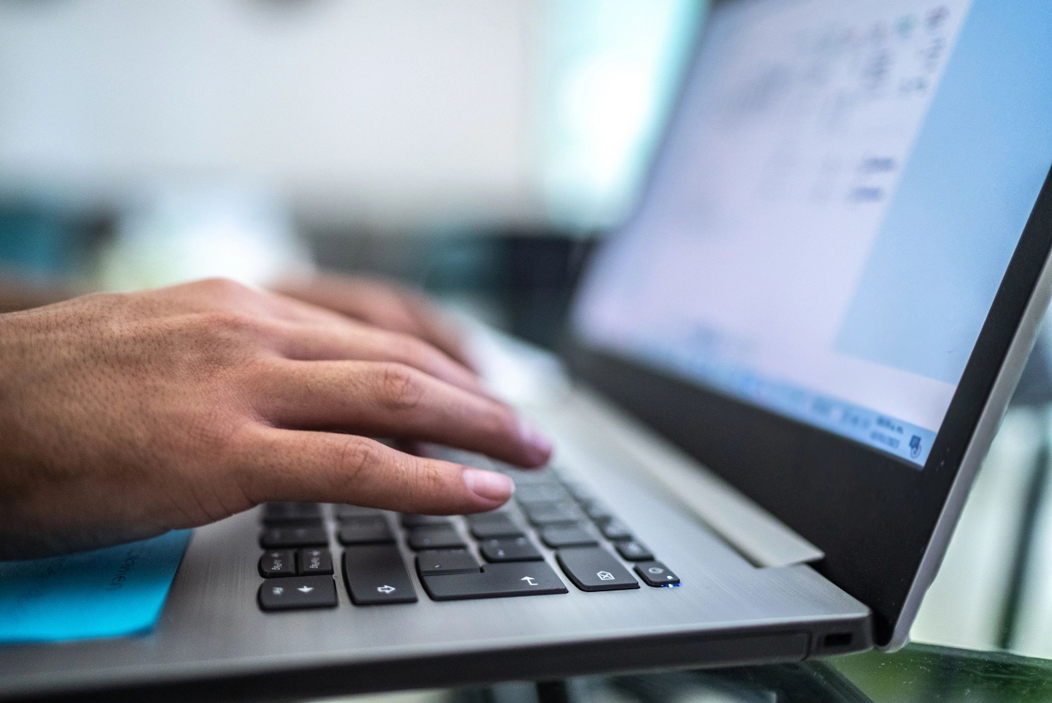 Close-up of a person using a laptop